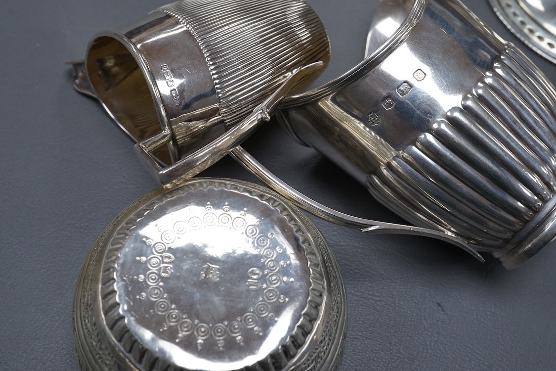 A George V demi-fluted silver cream jug, by William Hutton & Sons Ltd, Sheffield, 1922, height 98mm, together with a smaller silver ream jug, a small silver pedestal bowl and a late Victorian silver Anglo-Indian sugar bo
